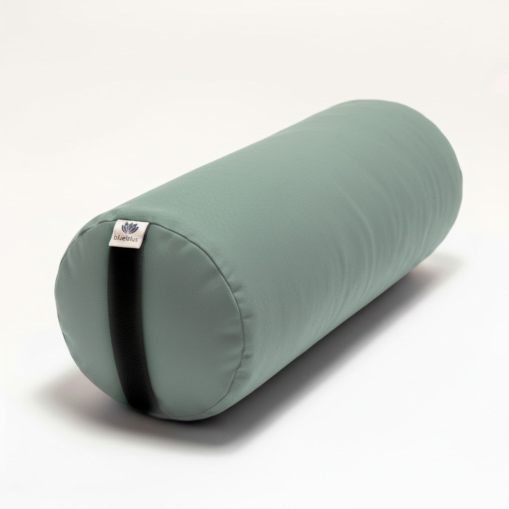 Sage green Round Yoga Bolster with black carrying strap on a white background
